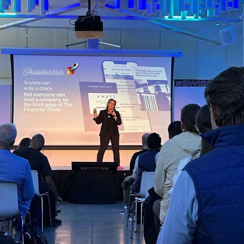 Katie speaking on stage